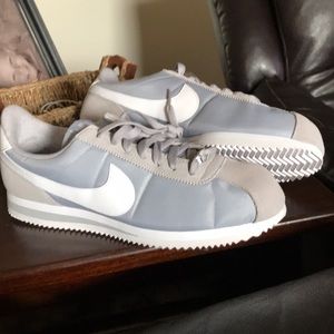 Grey and white Nike Cortez